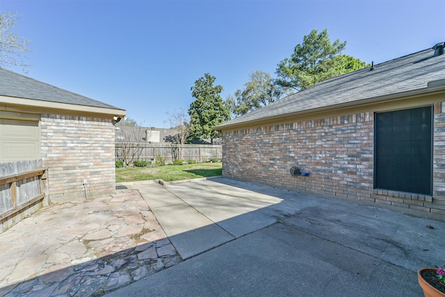 view of patio / terrace featuring fence