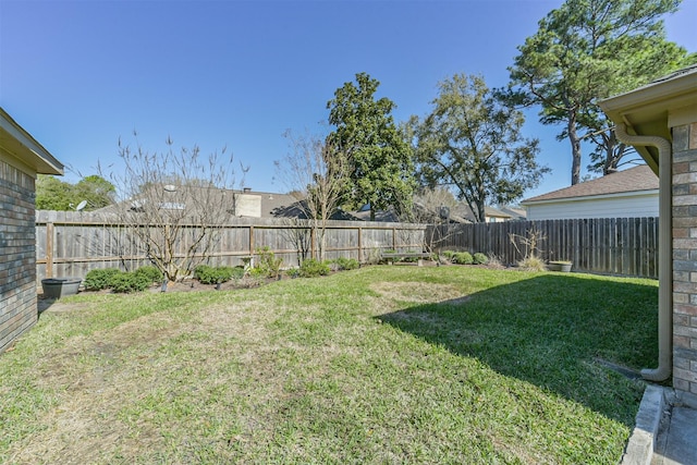 view of yard with a fenced backyard