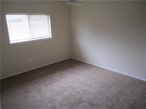 unfurnished room featuring carpet