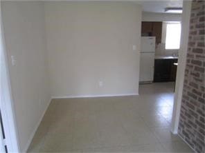 empty room with baseboards