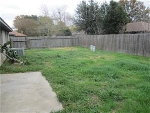 view of yard featuring a patio area and a fenced backyard