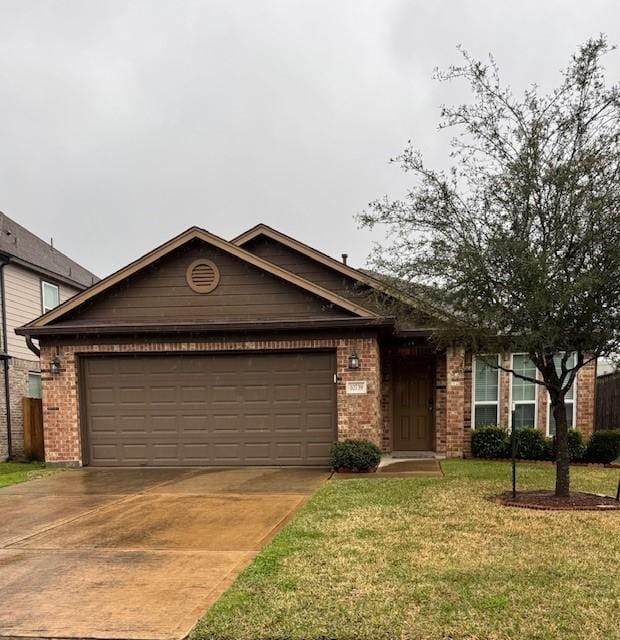 view of front of house with a garage, brick siding, concrete driveway, and a front yard