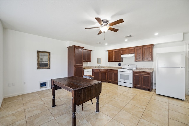 kitchen with white appliances, light tile patterned floors, a ceiling fan, visible vents, and under cabinet range hood