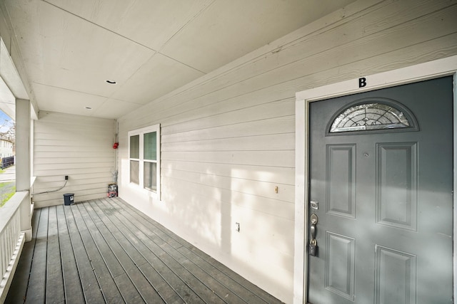 doorway to property featuring covered porch