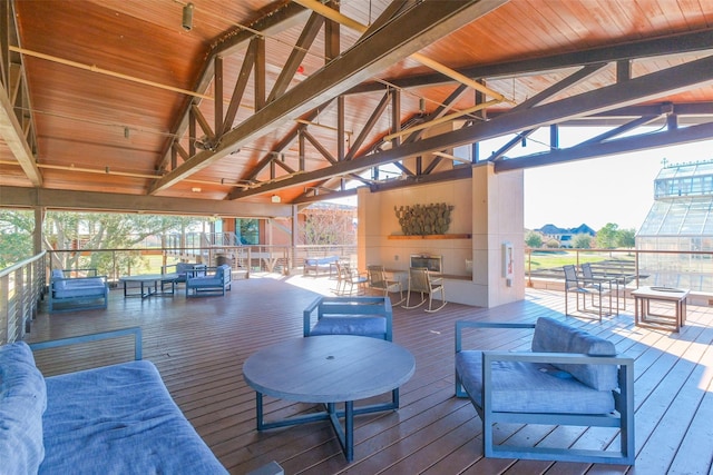 wooden terrace featuring outdoor lounge area