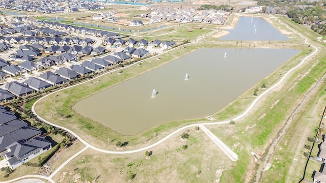 birds eye view of property featuring a water view and a residential view