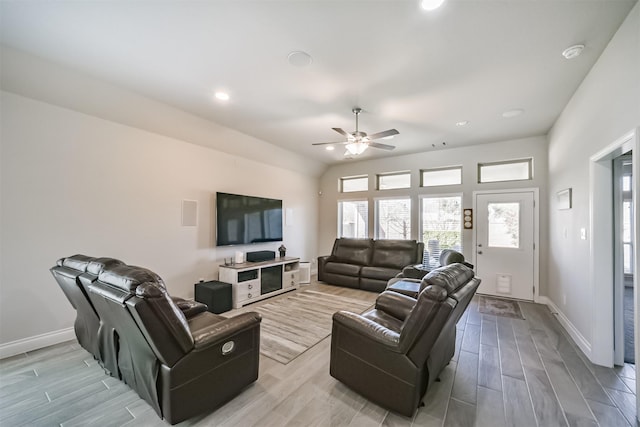 living area featuring recessed lighting, light wood-style floors, baseboards, and ceiling fan