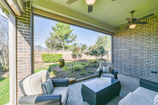 view of patio / terrace with an outdoor living space, a fenced backyard, and ceiling fan