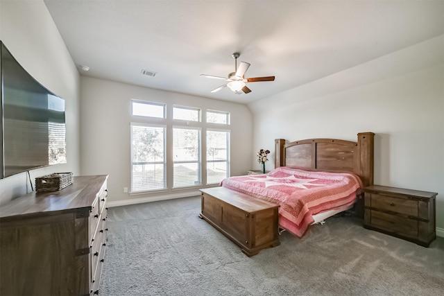 carpeted bedroom featuring visible vents, ceiling fan, and baseboards