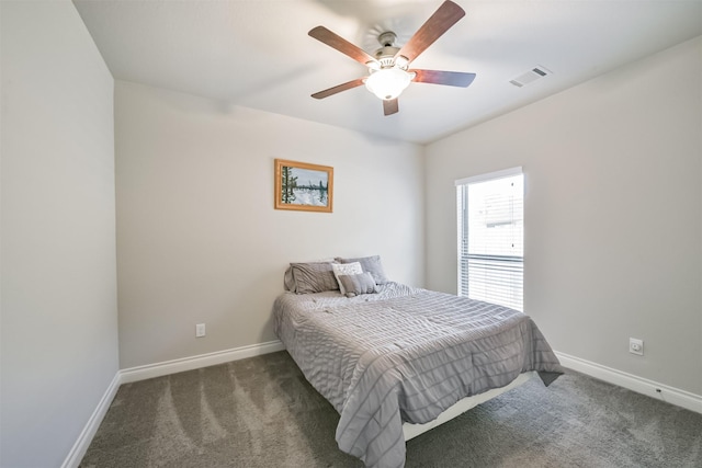 carpeted bedroom featuring visible vents, baseboards, and ceiling fan