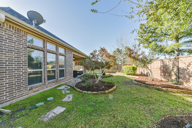 view of yard featuring a fenced backyard and a patio area