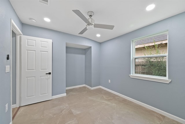 empty room with recessed lighting, a ceiling fan, and baseboards