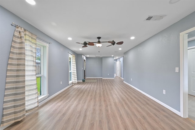 unfurnished living room with visible vents, recessed lighting, light wood finished floors, baseboards, and ceiling fan