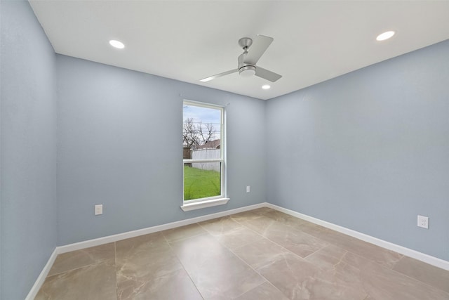 spare room featuring recessed lighting, a ceiling fan, and baseboards