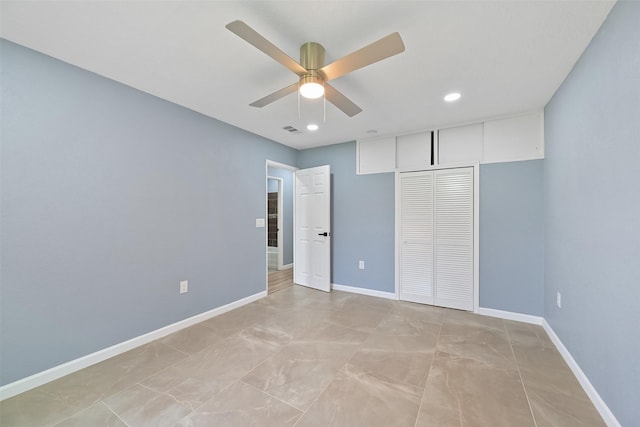 unfurnished bedroom with a ceiling fan, baseboards, visible vents, and a closet