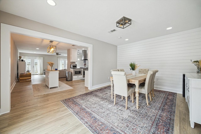 dining space with visible vents, recessed lighting, baseboards, and light wood-style floors