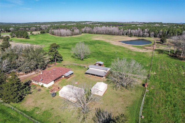 birds eye view of property featuring a water view and a rural view