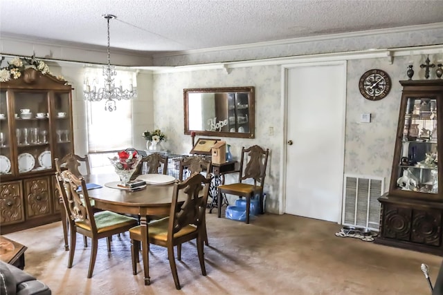 dining room with visible vents, ornamental molding, a textured ceiling, an inviting chandelier, and wallpapered walls
