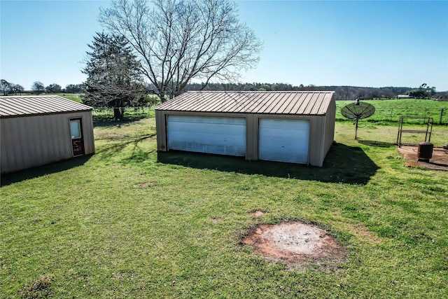 exterior space featuring an outbuilding and a garage