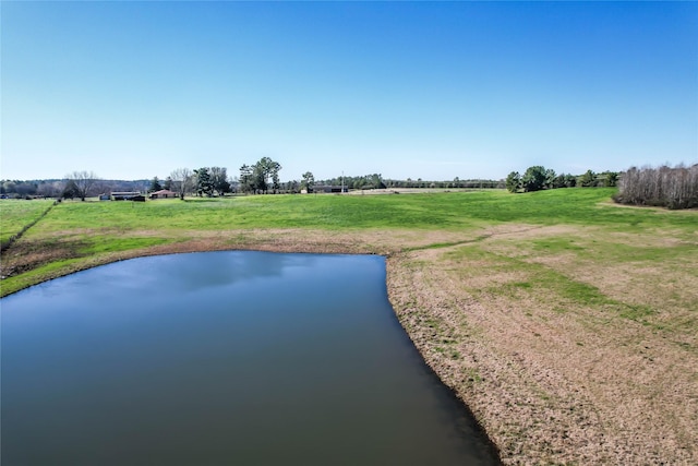 view of home's community featuring a yard and a water view