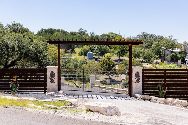 view of gate with fence