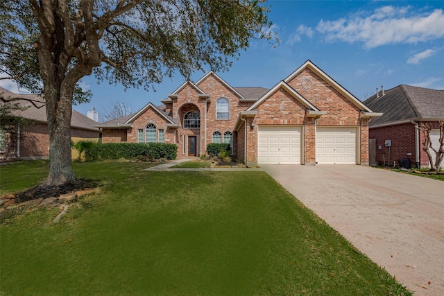 traditional home with central air condition unit, driveway, a front yard, a garage, and brick siding