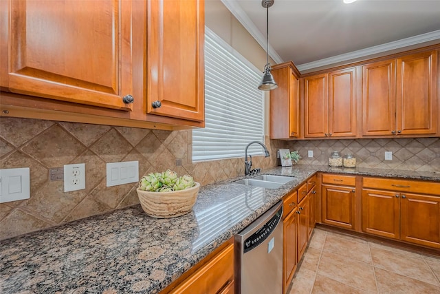 kitchen featuring dark stone countertops, brown cabinetry, a sink, dishwasher, and crown molding