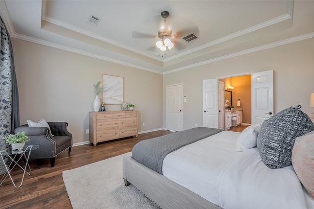 bedroom featuring a raised ceiling, baseboards, visible vents, and dark wood-style flooring