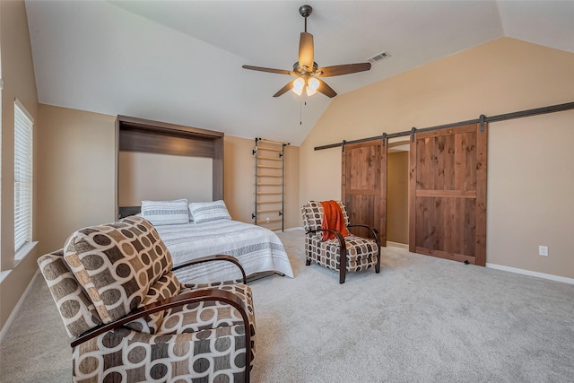 bedroom with visible vents, ceiling fan, a barn door, carpet floors, and vaulted ceiling