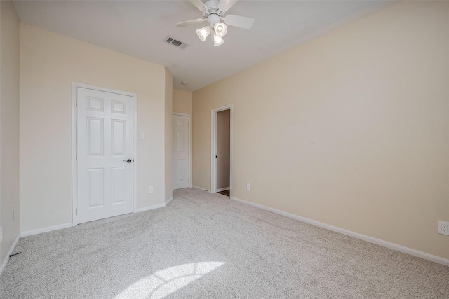 unfurnished bedroom featuring visible vents, ceiling fan, baseboards, and carpet