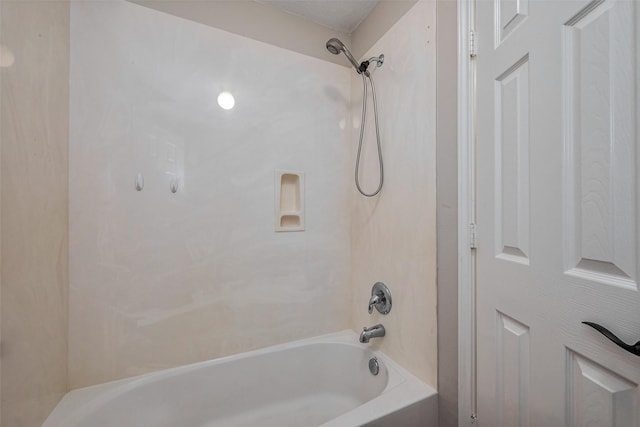 bathroom with bathing tub / shower combination