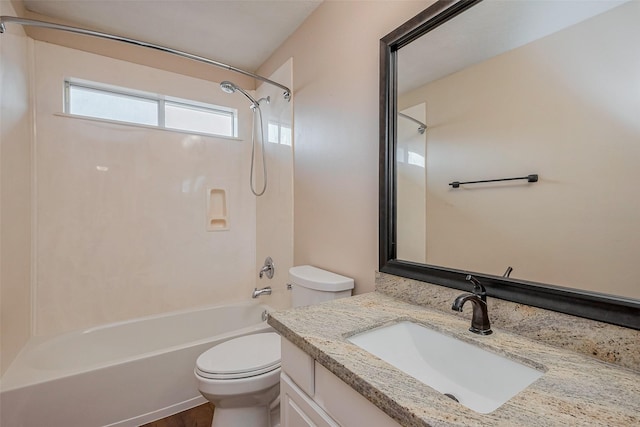 full bathroom with vanity, toilet, and washtub / shower combination