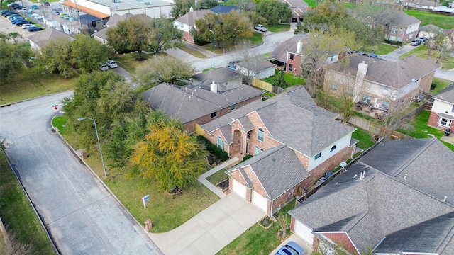 birds eye view of property with a residential view