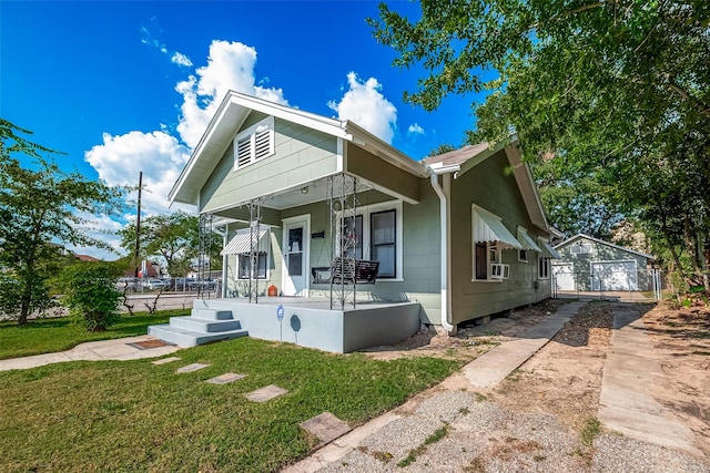 view of front facade with cooling unit, a porch, a front yard, and fence