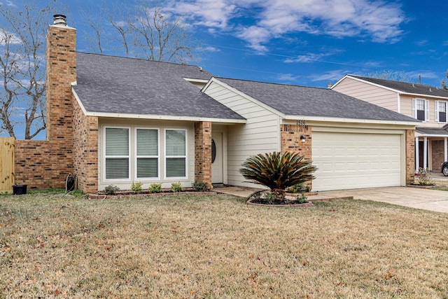 view of front facade with brick siding, an attached garage, driveway, and a front yard