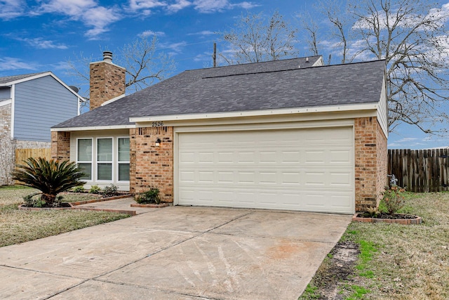 view of front of property featuring fence, driveway, an attached garage, a chimney, and brick siding