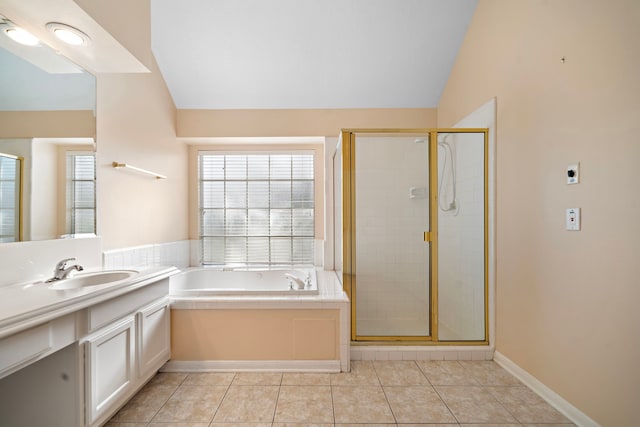 full bath with tile patterned flooring, a shower stall, vanity, and lofted ceiling