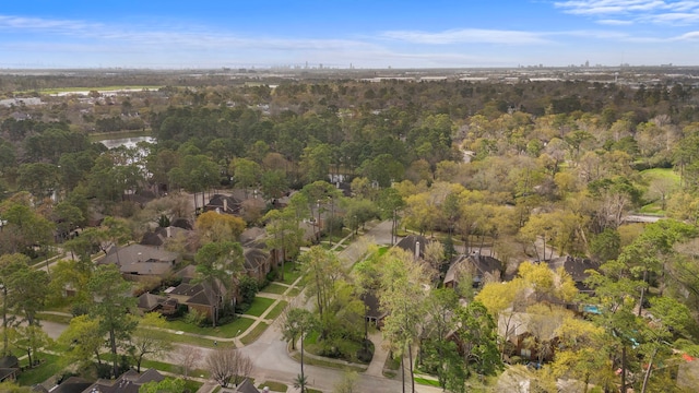 drone / aerial view featuring a forest view