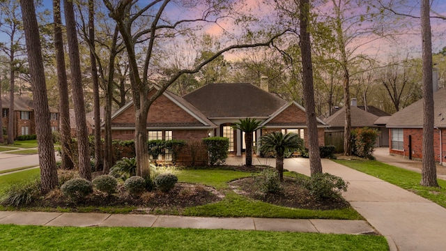 view of front facade featuring brick siding