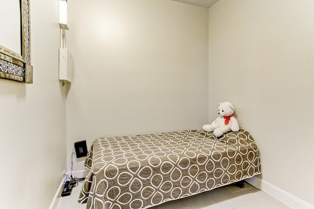 tiled bedroom with baseboards