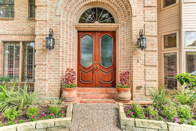 entrance to property with brick siding