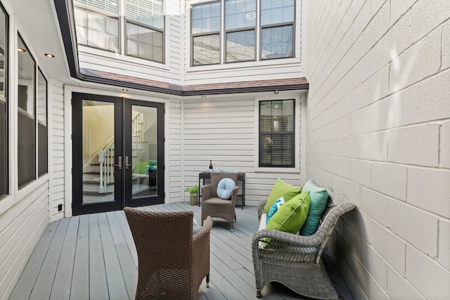 wooden deck featuring french doors