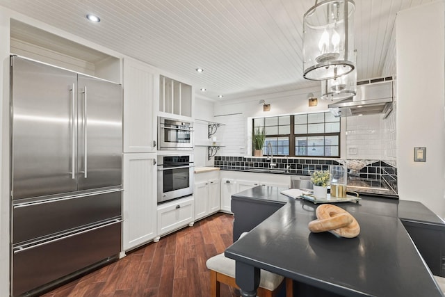 kitchen featuring backsplash, dark wood finished floors, appliances with stainless steel finishes, white cabinets, and open shelves