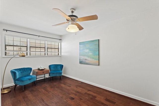 sitting room featuring baseboards, ceiling fan, and hardwood / wood-style flooring