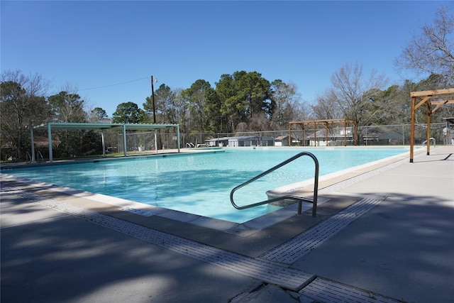 pool featuring a patio and fence