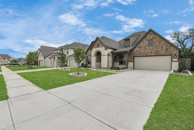 french provincial home featuring brick siding, stone siding, concrete driveway, and a front yard