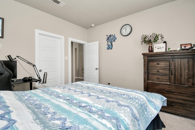 bedroom with visible vents and carpet floors