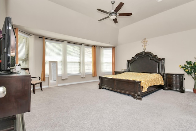 bedroom featuring a ceiling fan, lofted ceiling, baseboards, and carpet floors