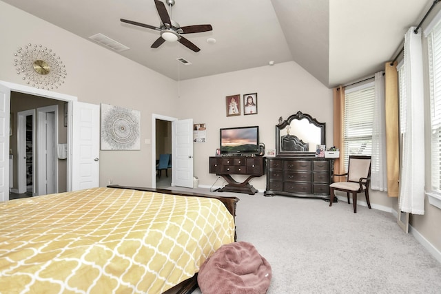 bedroom with visible vents, lofted ceiling, carpet, and baseboards