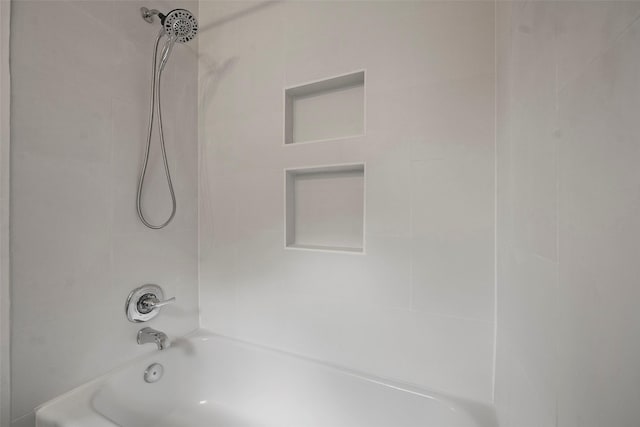 interior details with shower / tub combination